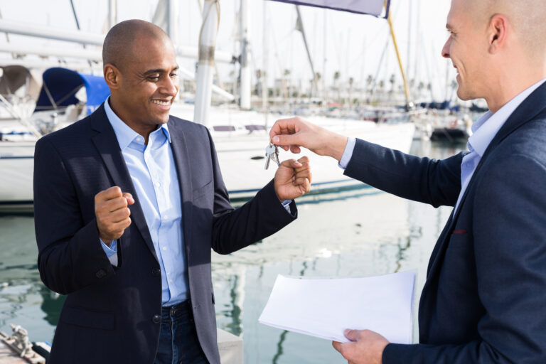 two men in suits buy and sell a yacht in the seaport