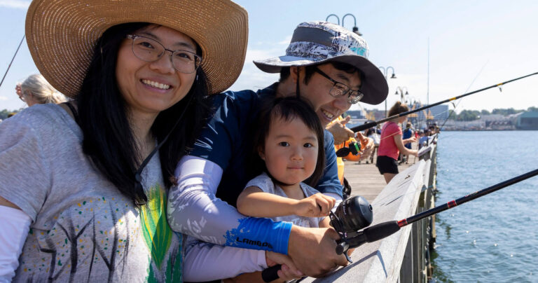 A family enjoys fishing at one of our state parks.